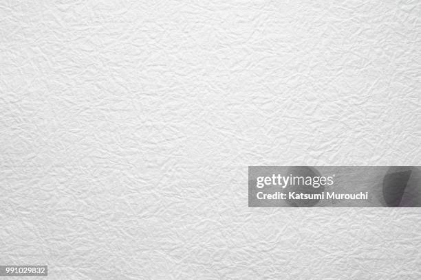 winkled white washi paper texture background - katsumi murouchi stock-fotos und bilder