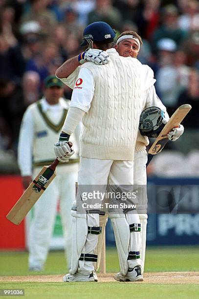 Graham Thorpe of England is congratulated on his hundred by Michael Vaughan during the Second Npower Test match between England and Pakistan at Old...