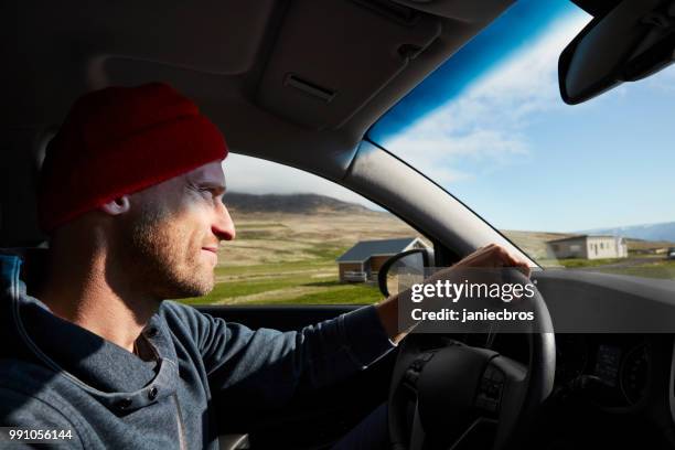 icelandic road trip. looking through a car window - knit hat stock pictures, royalty-free photos & images