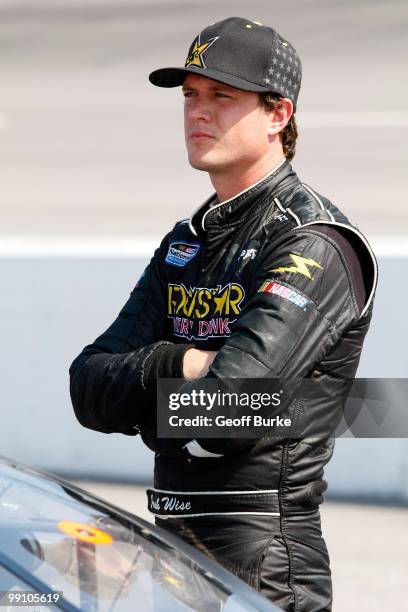 Josh Wise, driver of the Ride to the Rock for Autism Ford, looks on during qualifying for the NASCAR Nationwide series Royal Purple 200 presented by...