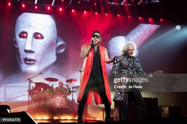 Roger Taylor, Adam Lambert & Brian May of Queen perform at The O2 Arena on July 1, 2018 in London, England.