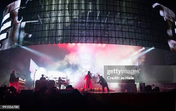 Roger Taylor, Adam Lambert & Brian May of Queen perform at The O2 Arena on July 1, 2018 in London, England.