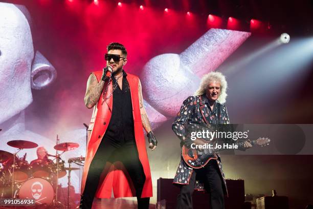 Roger Taylor, Adam Lambert & Brian May of Queen perform at The O2 Arena on July 1, 2018 in London, England.