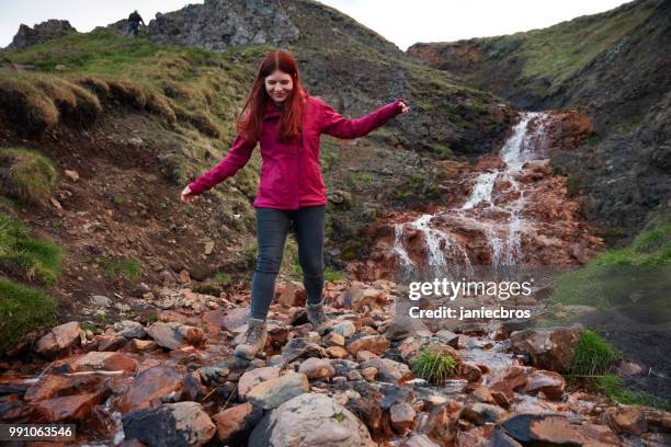 crossing mountain stream - waterfall jump stock pictures, royalty-free photos & images