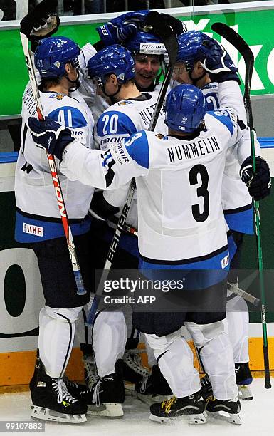 Finland's players celebrate scoring their first goal during the IIHF Ice Hockey World Championship match Finland vs United States in the western...