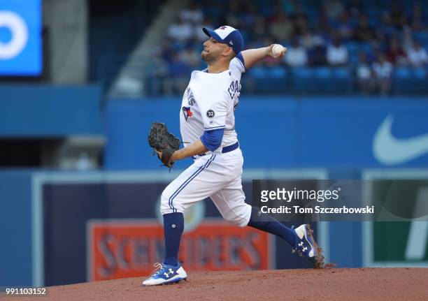 Marco Estrada of the Toronto Blue Jays delivers a pitch in the first inning during MLB game action against the New York Mets at Rogers Centre on July...