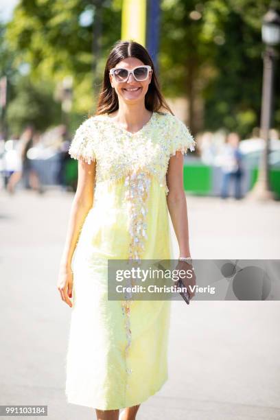 Giovanna Battaglia wearing yellow dress seen outside Chanel on day three during Paris Fashion Week Haute Couture FW18 on July 2, 2018 in Paris,...