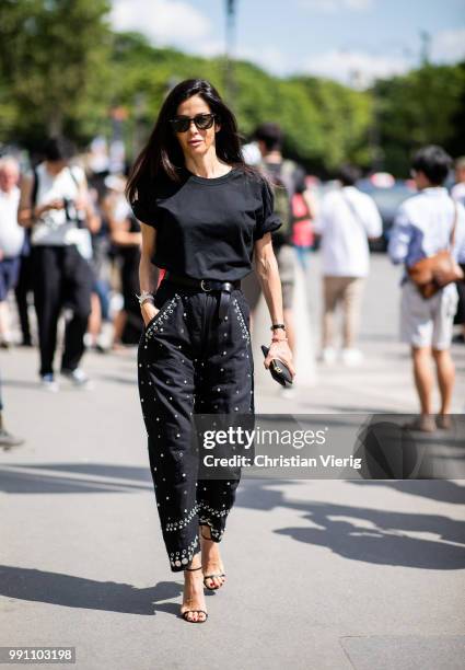 Barbara Martelo wearing black cropped pants and tshirt is seen outside Chanel on day three during Paris Fashion Week Haute Couture FW18 on July 2,...