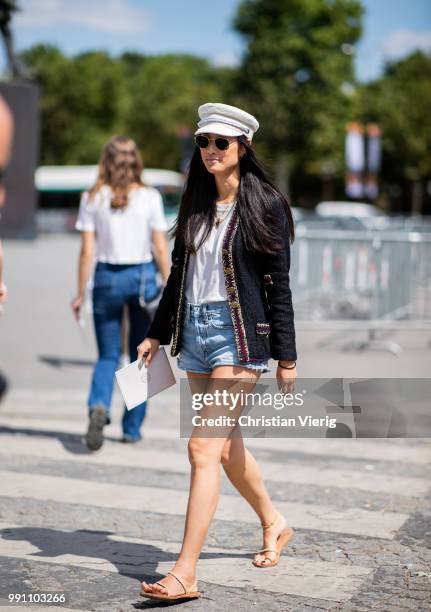 Barbara Martelo wearing black cropped pants and tshirt is seen outside Chanel on day three during Paris Fashion Week Haute Couture FW18 on July 2,...