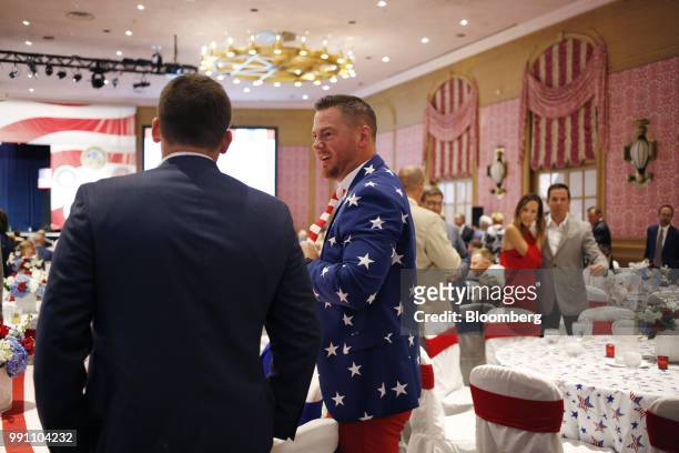 An attendee wearing American flag themed attire stands ahead of a Salute to Service dinner with U.S. President Donald Trump, not pictured, in White...
