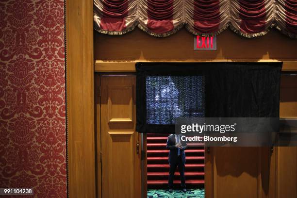 Secret Service agent stands guard in a hallway ahead of a Salute to Service dinner with U.S. President Donald Trump, not pictured, in White Sulphur...