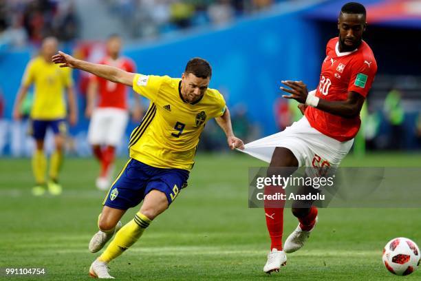 Marcus Berg of Sweden in action against Johan Djourou of Switzerland during the 2018 FIFA World Cup Russia Round of 16 match between Sweden and...