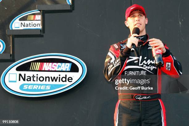 Denny Hamlin, driver of the Z-Line Designs / Operations Helmet Toyota, addresses the fans prior to the start of the NASCAR Nationwide series Royal...