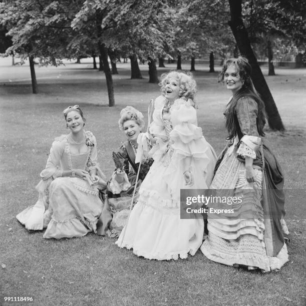 Actresses Linda Thorson, Sheila Allen , Fenella Fielding, and Alexandra Bastedo wearing period costumes in Greenwich Park, London, UK, 13th June 1973.