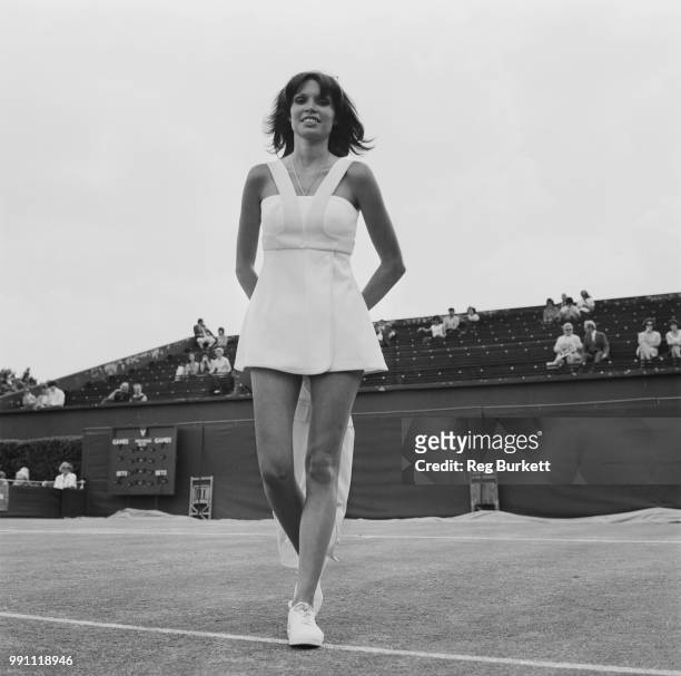 French socialite Dominique Grazia, wife of tennis player Ilie Nastase, modelling tennis outfit at Queen's Club, London, UK, 24th June 1973.