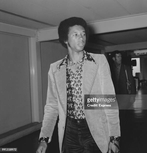 American professional tennis player Arthur Ashe arrive at Heathrow Airport, London, UK, 26th June 1973.