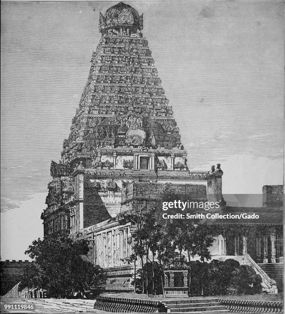 Black and white photograph of a large South Indian temple, possibly the Chola dynasty Brihadisvara Temple, located in Thanjavur, Tamil Nadu, India,...