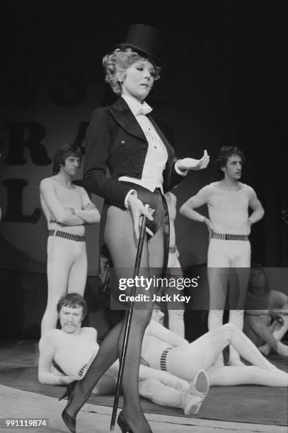 English actress Diana Rigg wearing top hat and tails during rehearsals for the play 'Jumpers', at the Old Vic Theatre, London, 2nd February 1973.