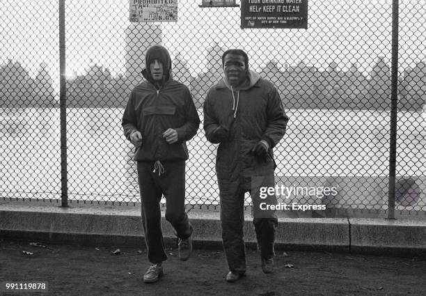 British lightweight boxer Ken Buchanan and American boxer Emile Griffith 91938 - 2013) training together in Central Park, New York, US, 20th January...