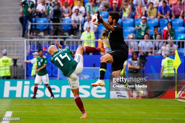 Javier Hernandez of Mexico fights for the ball with Alisson of Brazil during the 2018 FIFA World Cup Russia Round of 16 match between Brazil and...