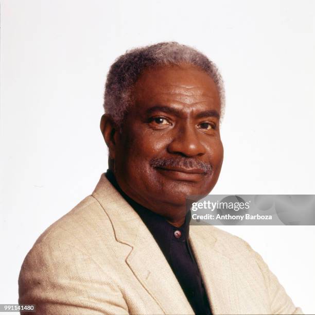 Portrait of American actor and Civil Rights activist Ossie Davis as he poses against a white background, New York, New York, 1980s.