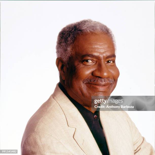 Portrait of American actor and Civil Rights activist Ossie Davis as he poses against a white background, New York, New York, 1980s.