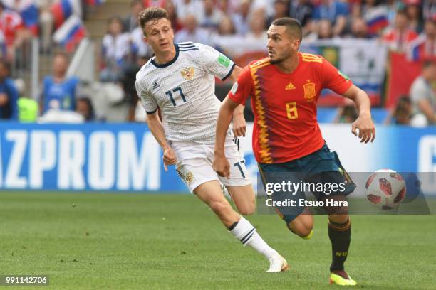 Koke of Spain and Aleksandr Golovin of Russia compete for the ball during the 2018 FIFA World Cup Russia Round of 16 match between Spain and Russia...