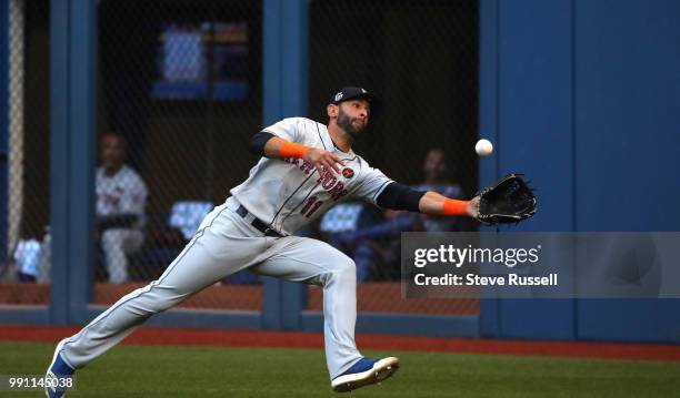 New York Mets right fielder Jose Bautista makes a catch off a Russell Martin hit to record the third out of the first inning as the Toronto Blue Jays...