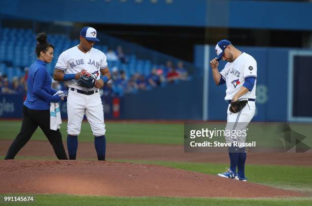 Toronto Blue Jays starting pitcher Marco Estrada leaves the game injured in the first inning as the Toronto Blue Jays play the New York Mets at...