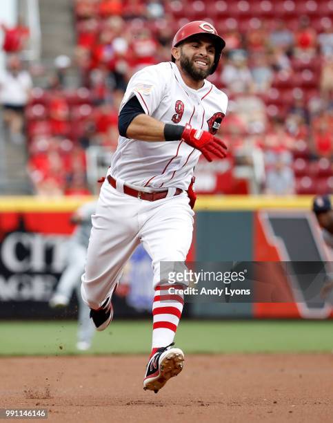 Jose Peraza of the Cincinnati Reds runs to third base for a tripple in the first inning against the Chicago White Sox at Great American Ball Park on...