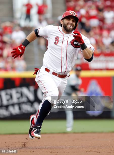 Jose Peraza of the Cincinnati Reds runs to third base for a tripple in the first inning against the Chicago White Sox at Great American Ball Park on...