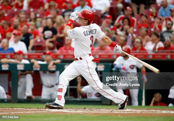 Scooter Gennett of the Cincinnati Reds hits a homerun in the first inning against the Chicago White Sox at Great American Ball Park on July 3, 2018...