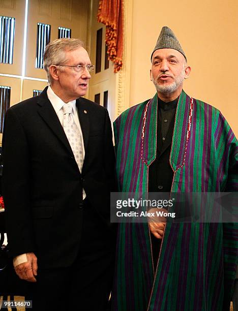 Afghan President Hamid Karzai and Senate Majority Leader Sen. Harry Reid at the beginning of a meeting on Capitol Hill May 12, 2010 in Washington,...