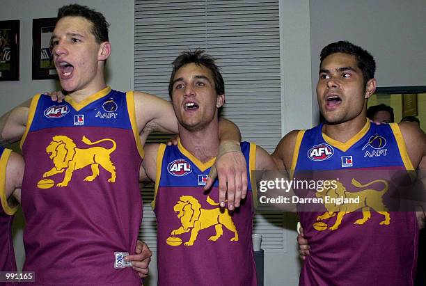 Beau McDonald, Daniel Bradshaw and Malcolm Michael of Brisbane celebrate winning against Richmond during the round 19 AFL match between the Brisbane...