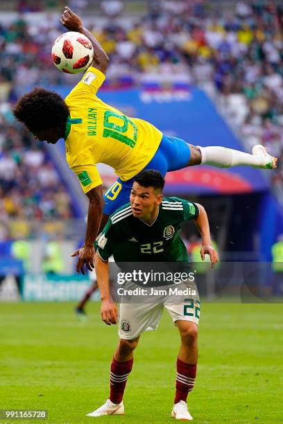 Willian of Brazil fights for the ball with Hirving Lozano of Mexico during the 2018 FIFA World Cup Russia Round of 16 match between Brazil and Mexico...