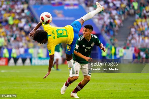 Willian of Brazil fights for the ball with Hirving Lozano of Mexico during the 2018 FIFA World Cup Russia Round of 16 match between Brazil and Mexico...
