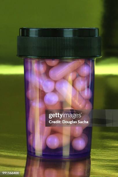 close-up of a bottle of designer drugs - medicare prescription drug plan stock pictures, royalty-free photos & images