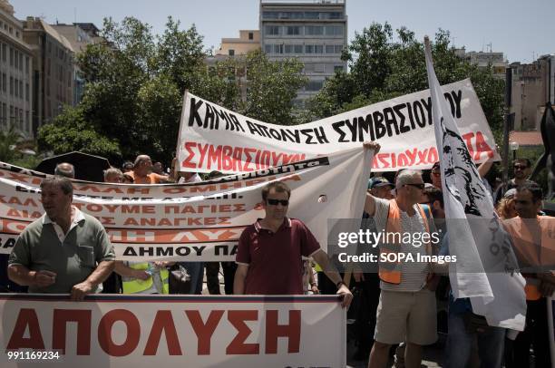 Fired contract workers holding banners and shouting slogans at the rally. The 450 redundant contractors of the Municipality of Thessaloniki protested...