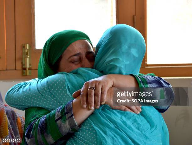 Family members and relatives of the slain militant mourn the death of their son. Family claiming the body of slain militant, Mudasir Ahmad Bhat, 31...