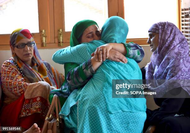 Family members and relatives of the slain militant mourn the death of their son. Family claiming the body of slain militant, Mudasir Ahmad Bhat, 31...