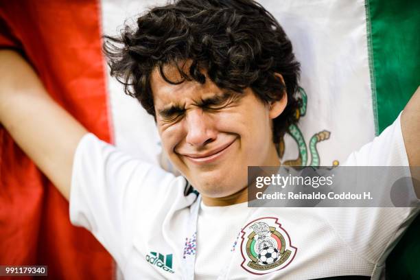 Fan of Mexico looks dejected after the elimination following the 2018 FIFA World Cup Russia Round of 16 match between Brazil and Mexico at Samara...