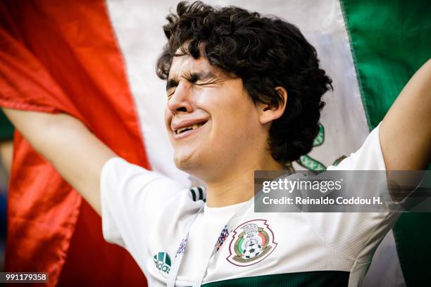 Fan of Mexico looks dejected after the elimination following the 2018 FIFA World Cup Russia Round of 16 match between Brazil and Mexico at Samara...