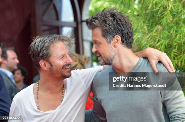 Wayne Carpendale and Philipp Hochmair during the Bavaria Film reception during the Munich Film Festival 2018 at Kuenstlerhaus am Lenbachplatz on July...