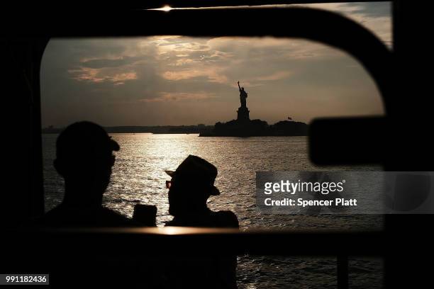 The Statue of Liberty stands in New York Harbor as America prepares to celebrate the 4th of July on July 3, 2018 in New York City. Across the nation,...