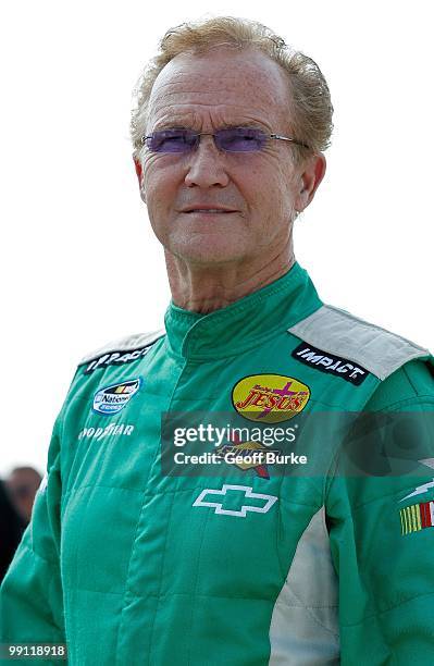 Morgan Shepherd , driver of the Racing with Jesus Chevrolet, looks on from the grid during qualifying for the NASCAR Nationwide series Royal Purple...