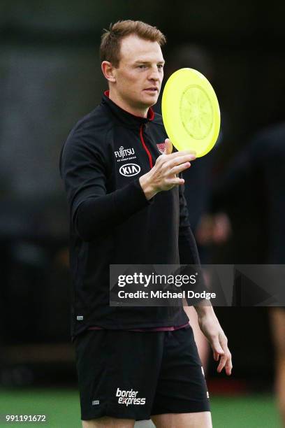 Brendon Goddard of the Bombers plays with a frisby during an Essendon Bombers AFL training session the Essendon Football Club on July 4, 2018 in...