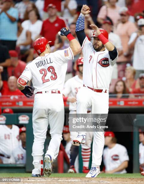 Adam Duvall of the Cincinnati Reds celebrates with Eugenio Suarez after hitting a home run in the fifth inning against the Chicago White Sox at Great...