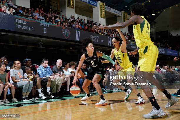 Bria Hartley of the New York Liberty handles the ball against Sue Bird of the Seattle Storm on July 3, 2018 at Westchester County Center in White...