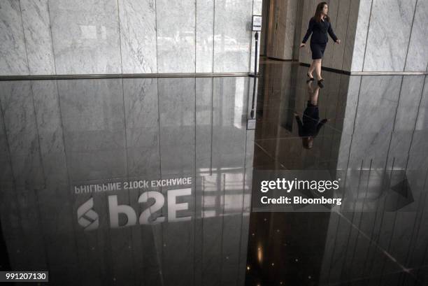 Signage for Philippine Stock Exchange Inc. Is reflected on the ground in the lobby of the bourse in Bonifacio Global City , Metro Manila, the...