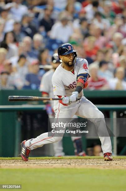 Eduardo Nunez of the Boston Red Sox hits a double in the eighth inning against the Washington Nationals at Nationals Park on July 3, 2018 in...